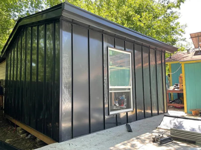 Black standing seam metal wall panels for Roof Inspection in Wasco